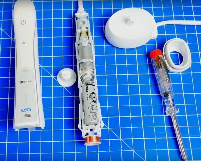 disasembled Oral B electric toothbrush