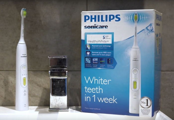 philips sonicare healthy white 5 series rechargeable sonic toothbrush on bathroom sink