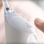 female hand holding Philips Sonicare Airfloss Ultra flosser